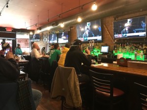 Fans watch the Eagles Super Bowl parade at a Philly bar in Hell's Kitchen, New York.