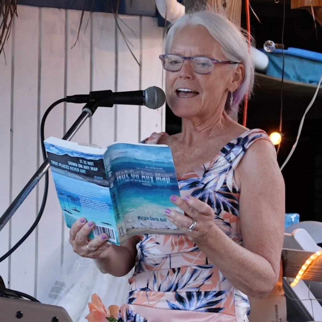 Author Margie Smith Holt reads from her memoir, NOT ON ANY MAP, at a book launch party in Coral Bay, St. John, USVI. November 10, 2022 Photo: William Stelzer